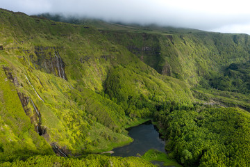 aerial landscape image of sunset sunrise over Po&ccedil;o Ribeira do Ferreiro waterfalls and Lagoa dos Patos 