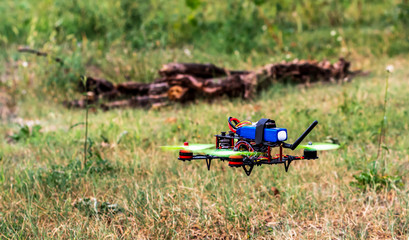 DIY drone taking off on the country field