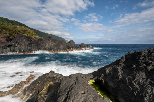 sunlight over the landscape at the Piscina Natural de Po&ccedil;a Sim&atilde;o Dias at the village of Faj&atilde; do Ouvidor, one of the most remarkable natural pools and fajas on the Azores Islands