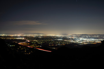 Night cityscape view from Rocky Peak above Porter Ranch in the San Fernando Valley area of Los Angeles, California.
