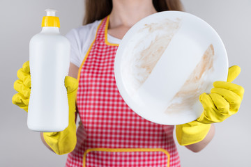 Cropped close up photo of positive satisfied in good mood lady demonstrating nice result advert the of working of new thick detergent holding in hands isolated grey background