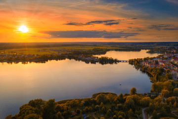 Sunset over Elk Lake near Elk city. Masuria, Poland. - obrazy, fototapety, plakaty