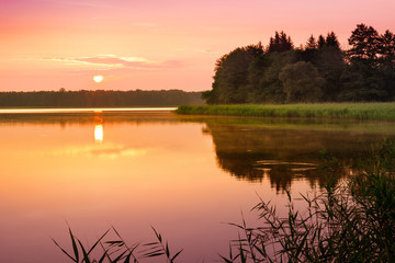 Fototapeta na wymiar Sunrise over Szarek Lake. Masuria. Poland.