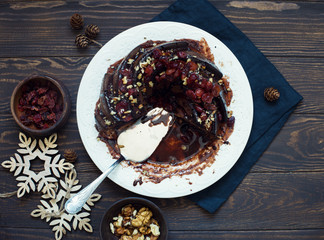Homemade chocolate cake with walnuts and dried cherries
