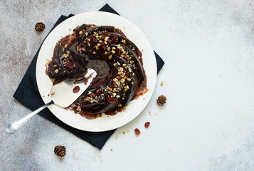 Homemade chocolate cake with walnuts and dried cherries