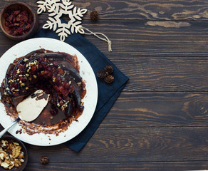 Homemade chocolate cake with walnuts and dried cherries