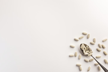 Spoon with dietary supplements. Flat lay.