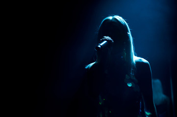 silhouette of long-haired singer