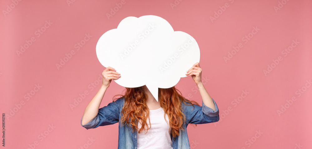 Wall mural girl holding empty speech bubble in front of her head