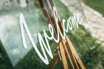 Close-up welcome sign - Welcome to a festive event or at the entrance. © franz12