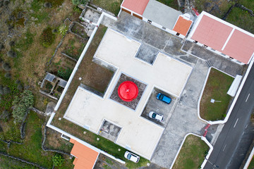 Aerial top view on the Ponta das Contendas Lighthouse on Terceira Island in the Azores