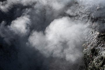 Fototapeta premium Detail of fumarole emitting gases and steam at the Jardim da Courela garden in the centre of the village of Furnas on São Miguel island in the Azores.