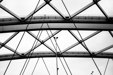 Structure of steel beams and cables in black and white