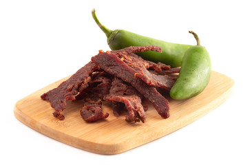 Jalapeno Flavored Gourmet Beef Jerky on a Wooden Cutting Board