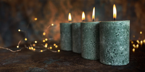 Candles on patinated background
