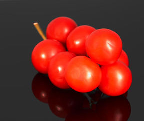 red tomatoes lie on the table