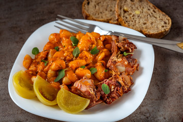 Beans stew with smoked pork meat and pickles