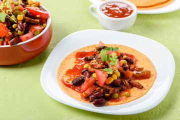 Tacos - delicious tortillas with meat and vegetables