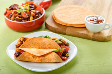 Tacos - delicious tortillas with meat and vegetables