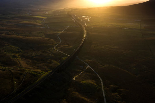 Ariel picture of Yorkshire landmark Ribblehead Viaduct, North Yorkshire, Yorkshire Dales, Sunrise, Clouds, Railway, Landscape, Grassland, Ingleborough © Julian Hodgson 2019