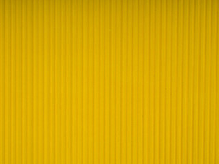 Yellow corrugated cardboard carton, texture background, colorful. Yellow corrugated cardboard carton in a colorful texture background series