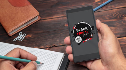 Black friday. A man is shopping at the online store