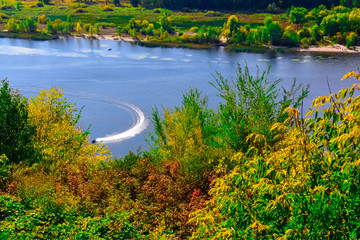 jet ski moves along the river or lake on a clear Sunny day in early autumn  © sorokinsamara