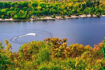 jet ski moves along the river or lake on a clear Sunny day in early autumn  © sorokinsamara