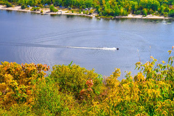 jet ski moves along the river or lake on a clear Sunny day in early autumn  © sorokinsamara