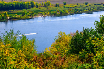 jet ski moves along the river or lake on a clear Sunny day in early autumn  © sorokinsamara
