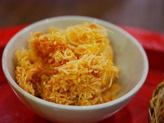 Selective focus of Thai sweeten crispy noodles ( Mee Krob ), Northern Thai snack served in a bowl