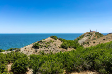 Natural landscape. The rocky coast of Cape Emine. The Bulgarian Black Sea Coast. In the background is the lighthouse building.