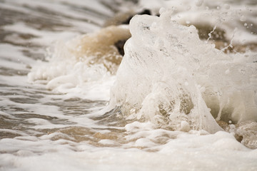 Close-up of Water Splashing onto Shore