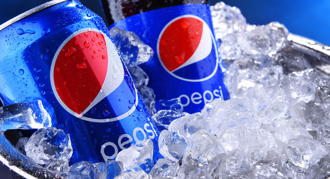 Bottle and can of Pepsi in bucket with crushed ice