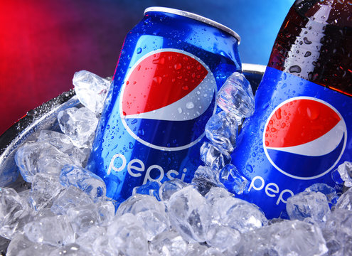 Bottle and can of Pepsi in bucket with crushed ice
