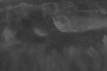 Black watercolor background on white paper. Paint leaks and ombre effects.	