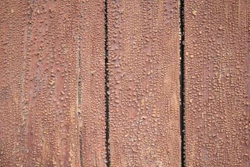 background of old irradiated boards of red color