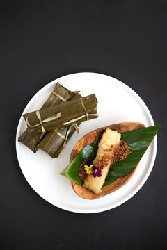Filipino dessert wrapped in banana leaves
