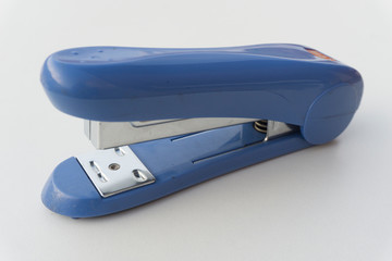 Blue stapler isolated on white background.