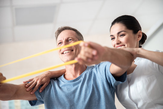 Hapy man with rubber band for fitness