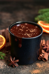 Homemade christmas hot chocolate with orange and spices.