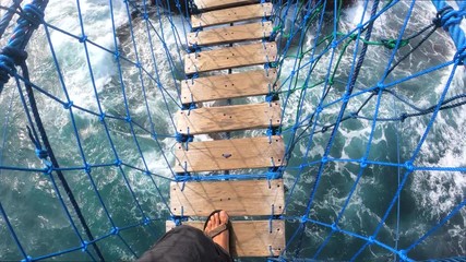 PoV action camera - person go to suspension bridge on Timang beach, Java island, Indonesia, Static Handled shot