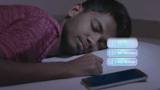 Concept showing of irregular sleep or sleep deprivation caused due to mobile phone, young adult got the message while sleeping causing disturbance and affects the sleep and health.