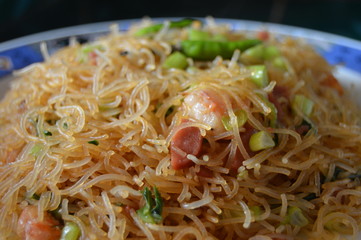 Fried noodles with tomato sauce and some shrimp. Enjoy with chilli or tomatto sauce.