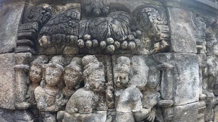 Stone images in the temple of Borabudur in Java island, Indonesia