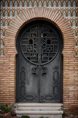 arab door in grenade, architecture detail of an arab door in grenade, spain.