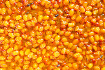 Fresh sea buckthorn jam. Close-up. Top view. Background. Texture.