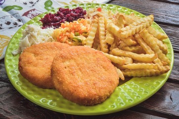 Tasty hot dinner. Quick dinner to prepare on a wooden table.