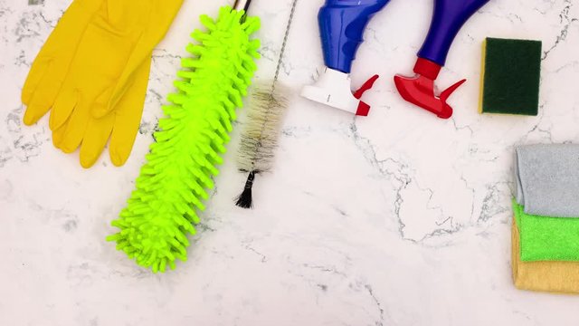 Stop motion animation of cleaning stuff and products from the table 