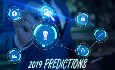 Writing note showing 2019 Predictions. Business concept for statement about what you think will happen in 2019 Male wear formal suit presenting presentation smart device